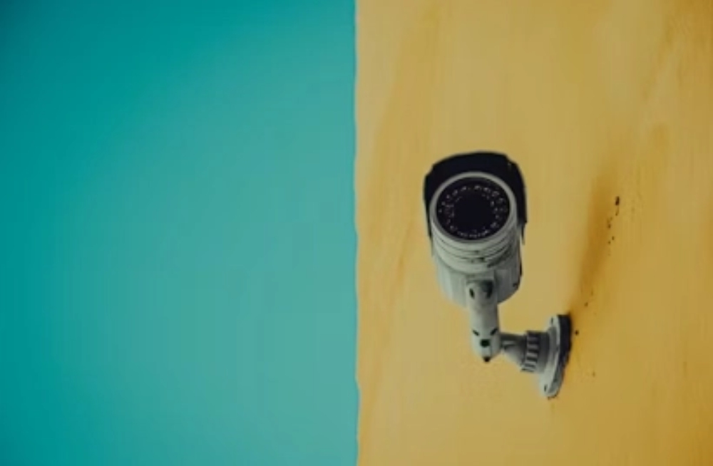camera against a blue and yellow background