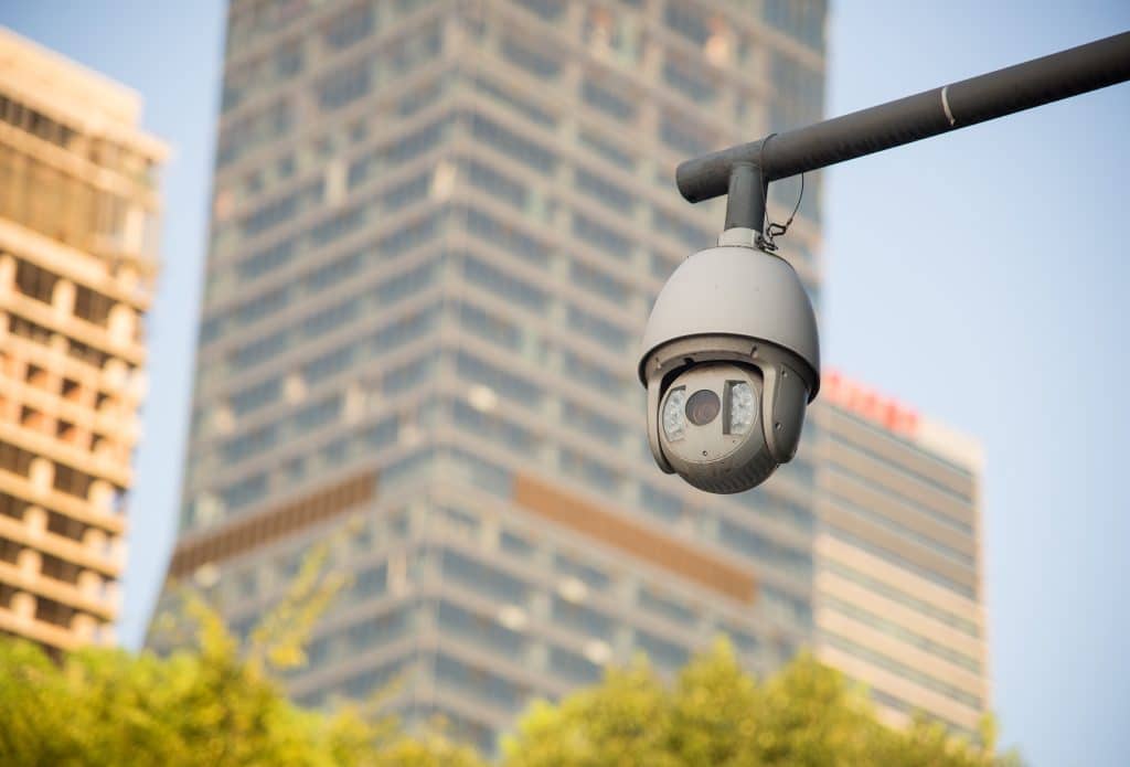behind the camera are tall buildings