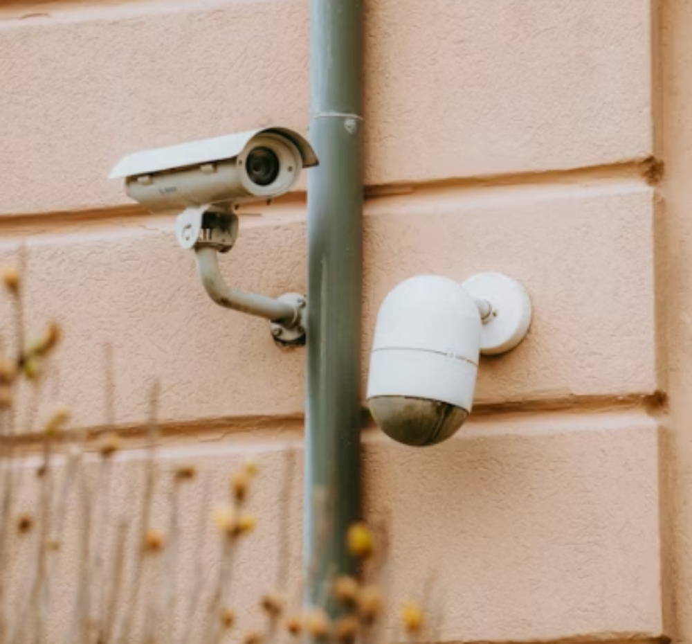 two different cameras on the wall