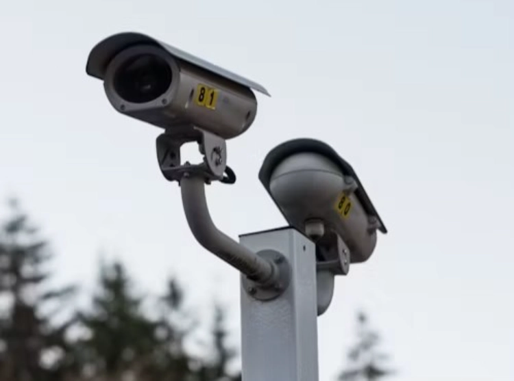 two surveillance cameras back to back