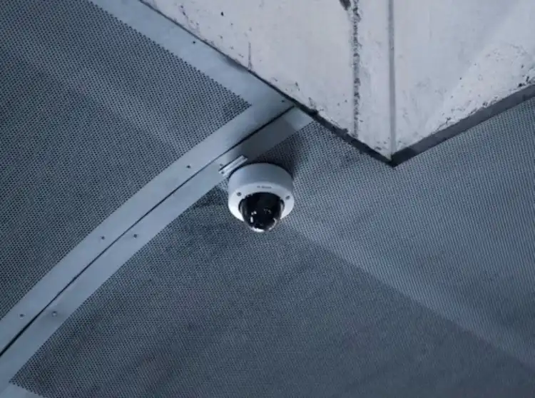 white surveillance camera on the roof