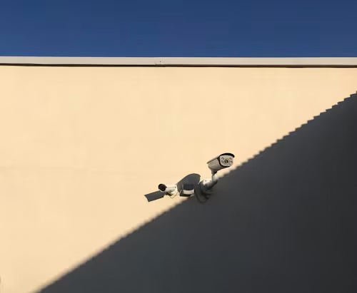 surveillance cameras in the light and shadow