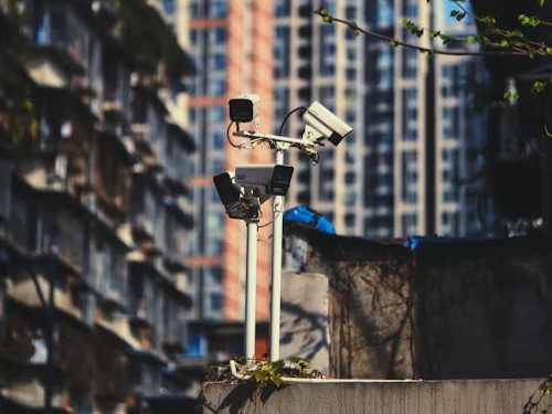 three surveillance cameras facing different directions